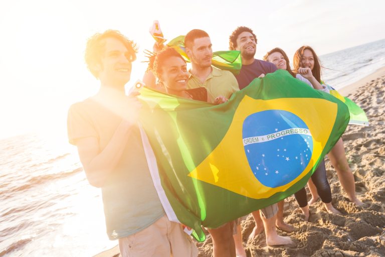Group of Friends with Brazilian Flag at Beach